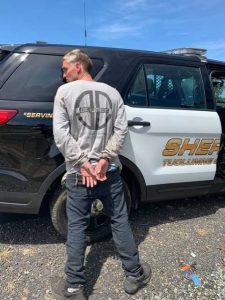 Graham being arrest while attempting to hitchhike on HWY 108 near La Grange Road