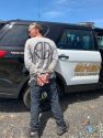 Graham being arrest while attempting to hitchhike on HWY 108 near La Grange Road