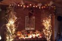 Corn stalks, gourds and a haystack with ceramic and other pumpkins in Francie McGowan's “autumnal shrine”