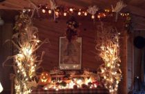 Corn stalks, gourds and a haystack with ceramic and other pumpkins in Francie McGowan's “autumnal shrine”