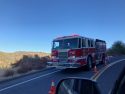Fire engine on scene of semi on its side along Parrotts Ferry Road causing one-way traffic