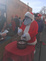 32nd Annual Sonora Bean Feed with Santa and candy canes on the serving line