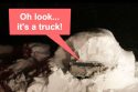 Pickup truck found burred beneath snow