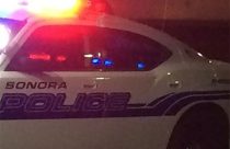 Sonora police patrol car at night
