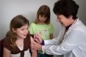 Young girl receives vaccination Immunization Action Coalition photo