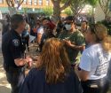 Oakdale Police Chief Scott Heller speaks with protesters
