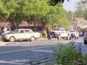 Car smashed into sidewalk and concrete fence of home next door to Red Church in Sonora
