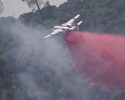 Columbia air tanker 83 dropping retardant on the fire off West Stockton Road