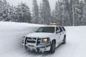 Caltrans vehicle shows how deep the snow is in the Arnold area of Calaveras County