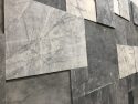 Stone wall behind judge bench in criminal courtroom