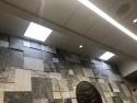 Stone wall behind judge bench in criminal courtroom
