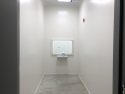 Holding cell with glass window for prisoners to talk privately with lawyers