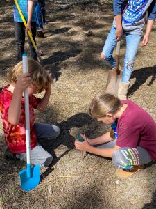 Students of Pinecrest Expedition Academy measuring PH levels of soil in preparation of planting