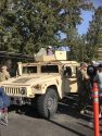 A young girl checks out the Humvee