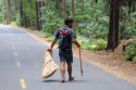 Volunteer picking up trash in the park