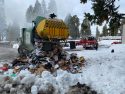 Waste Management recycling truck dumping load of trash that was on fire