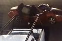Burglars loading stolen item into getaway vehicle