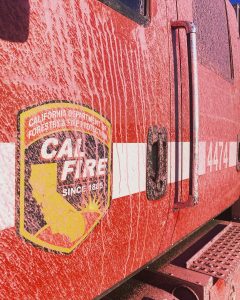 Cal Fire truck covered in fire retardant