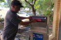 Voter putting ballot in drop box in Sonora