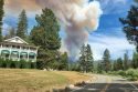 Picture of Wawona Hotel with large fire column in the background