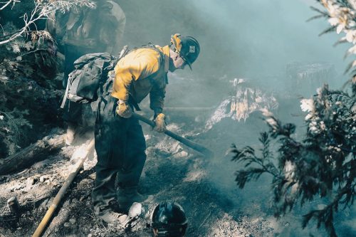 Firefighter working the Dodge Fire burning on the Stanislaus National Forest