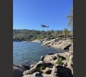Helicopter takes water from Pinecrest Lake Thursday to fight Dodge Fire - photo by Merv Cancio