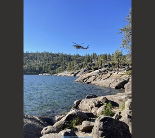 Helicopter takes water from Pinecrest Lake Thursday to fight Dodge Fire - photo by Merv Cancio