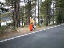 Caltrans District 10 crew member picking up traffic along Highway 108
