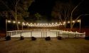 Completed ice rink lit up at night