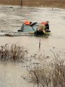 Rescue crews work on truck found in flooded area off Rail Road Flat Road