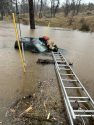 Rescue crews work on truck found in flooded area off Rail Road Flat Road