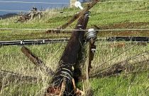Downed power pole and lines close a section of Hogan Dam Road in Calaveras County