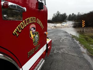 Vehicle stuck in flood water on Red Hills Road near Chinese Camp