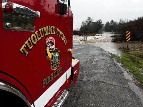 Vehicle stuck in flood water on Red Hills Road near Chinese Camp