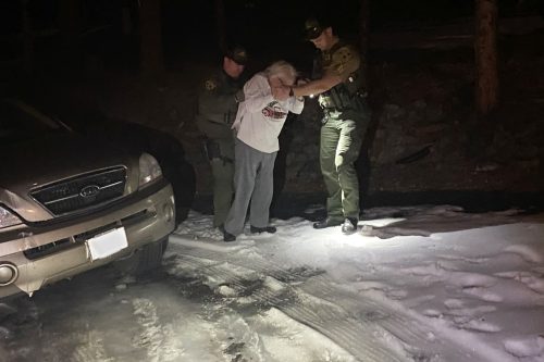 Deputies help elderly woman get from her car to the house