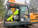 Caltrans worker clearing debris from HWY 120