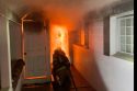 Firefighters heading into a burning home on Hess Avenue in Sonora on Tuesday night