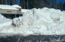 Snow pile high at the Meadowmont Shopping Center in the Arnold area of Calaveras County