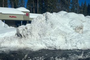 Snow pile high at the Meadowmont Shopping Center in the Arnold area of Calaveras County