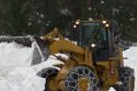 Snow plow working on roadways in the Curry Village area of Yosemite