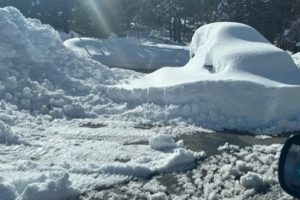 Car buried in snow In Arnold