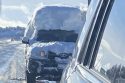 Vehicle with snow piled on top