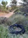Rolled up cable that was being dragged to the vehicle
