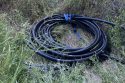 Rolled up cable that was being dragged to the vehicle