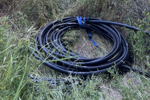 Rolled up cable that was being dragged to the vehicle
