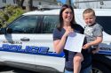 Brittaney Sutton and Wyatt holding form at Sonora Police Station
