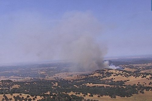 Vegetation fire in the Valley Springs area of Calaveras County at noon