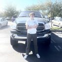 Missing teen 16-year-old Preston Lawrence Mueller in front of truck