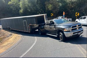Truck with trailer stuck on Highway 49 hairpin turn in the Tuttletown area of Tuolumne County