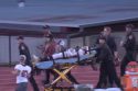 Concerned players looking on as Derek is being wheeled out of Thorsted Stadium in Tuolumne